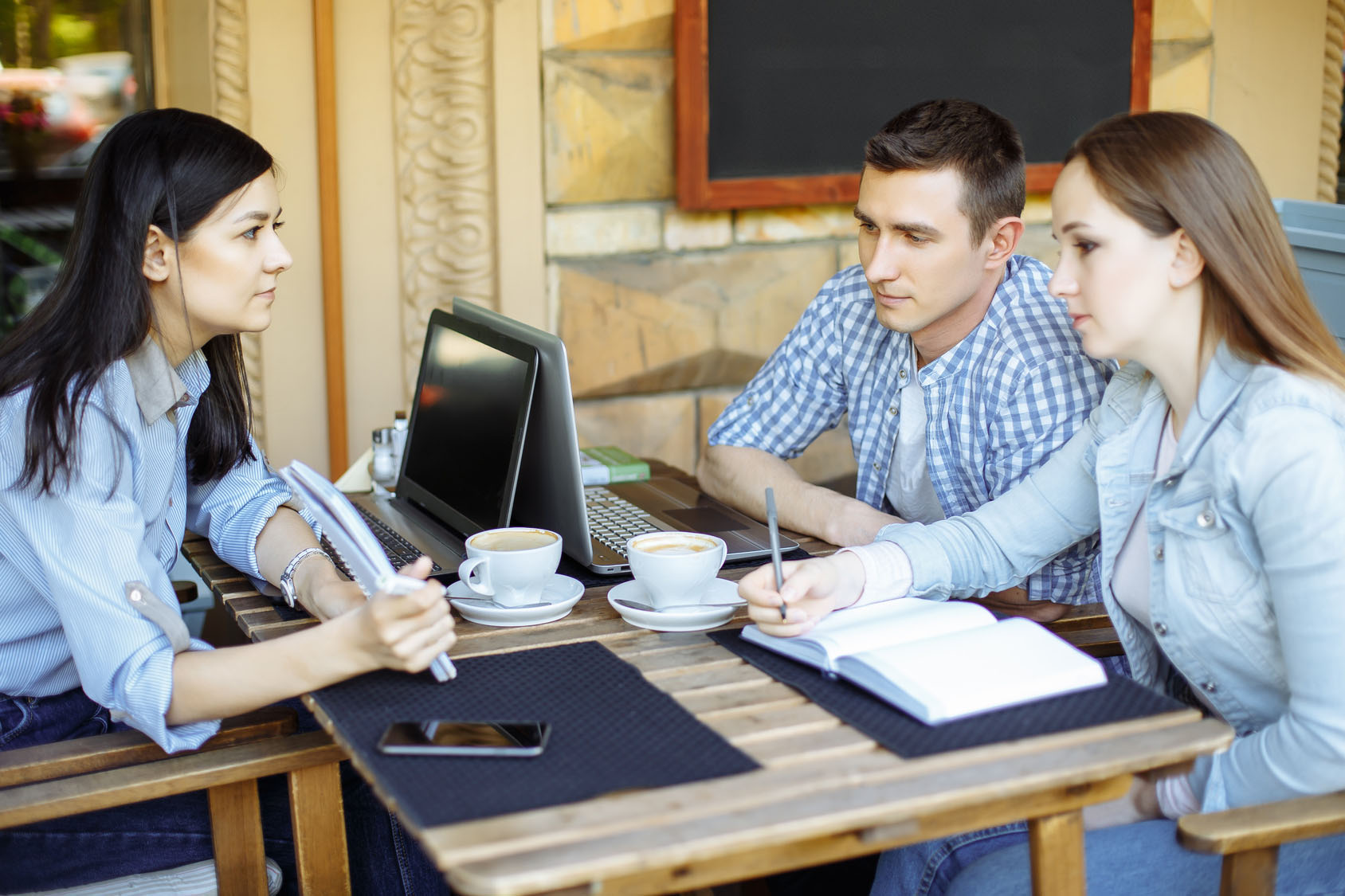 Students communicating at cafe after lesson